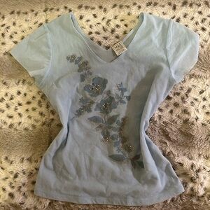 blue top with floral details
